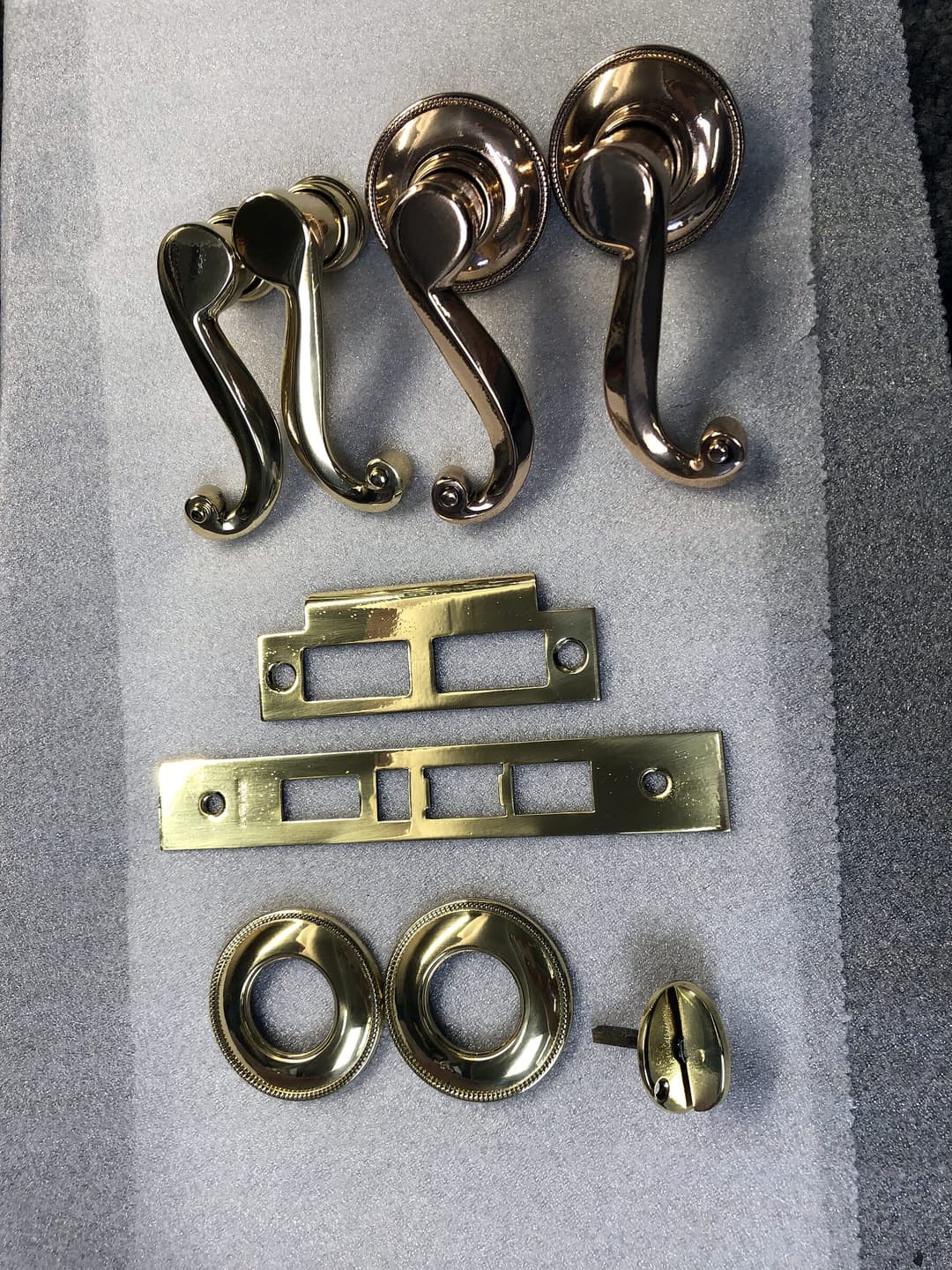 Door hardware after brass plating and polishing