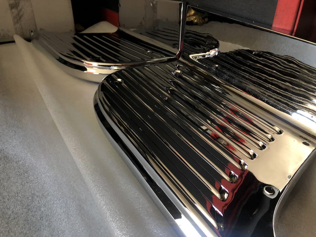Polished ribbed aluminum valve cover on the bench