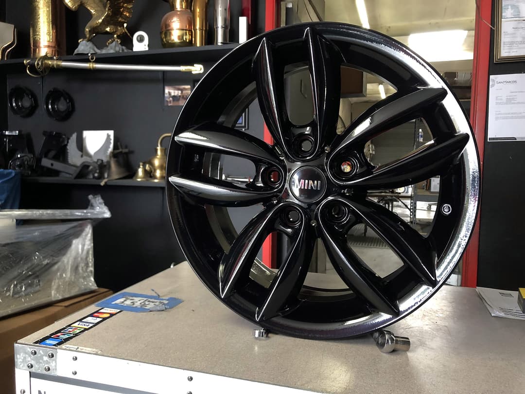 Gloss black powder-coated wheel on the bench