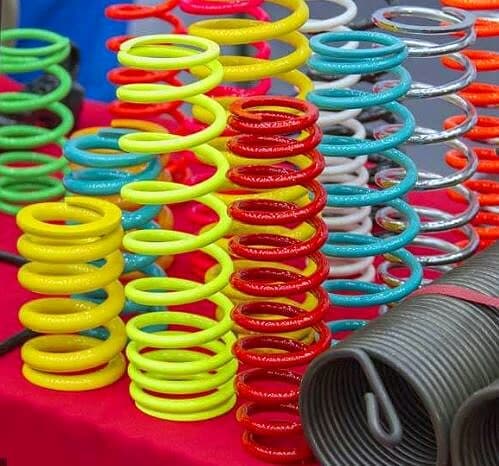 Coil springs powder coated in yellow, red, blue and green