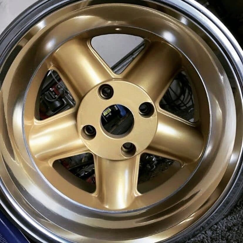 Wheel powder coated in gold with a polished lip