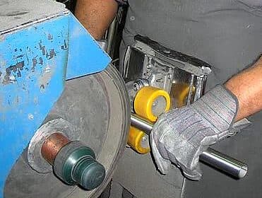 Polishing a part on the buffing wheel
