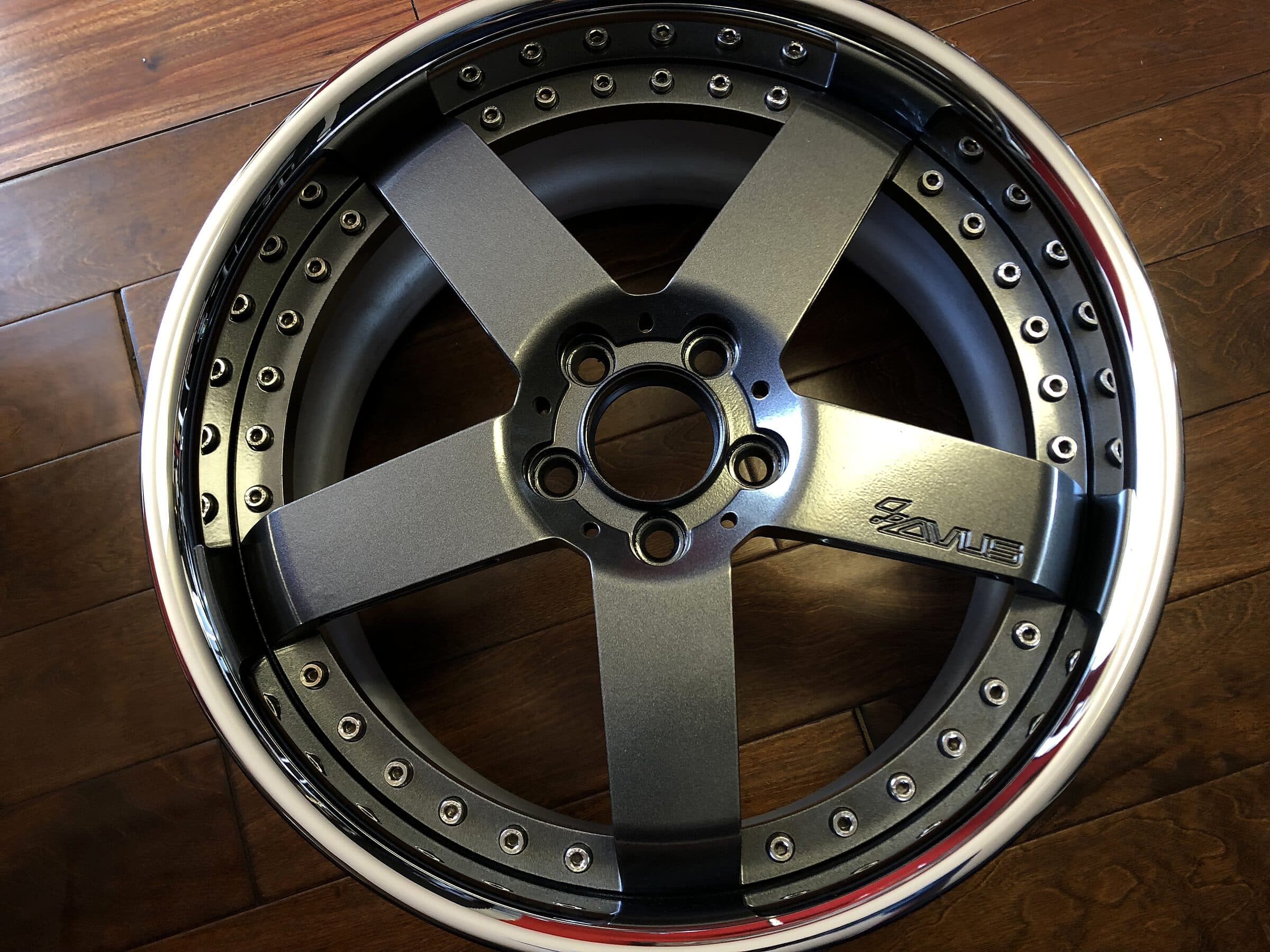 Two-tone wheel with a gunmetal powder-coated face and a polished lip